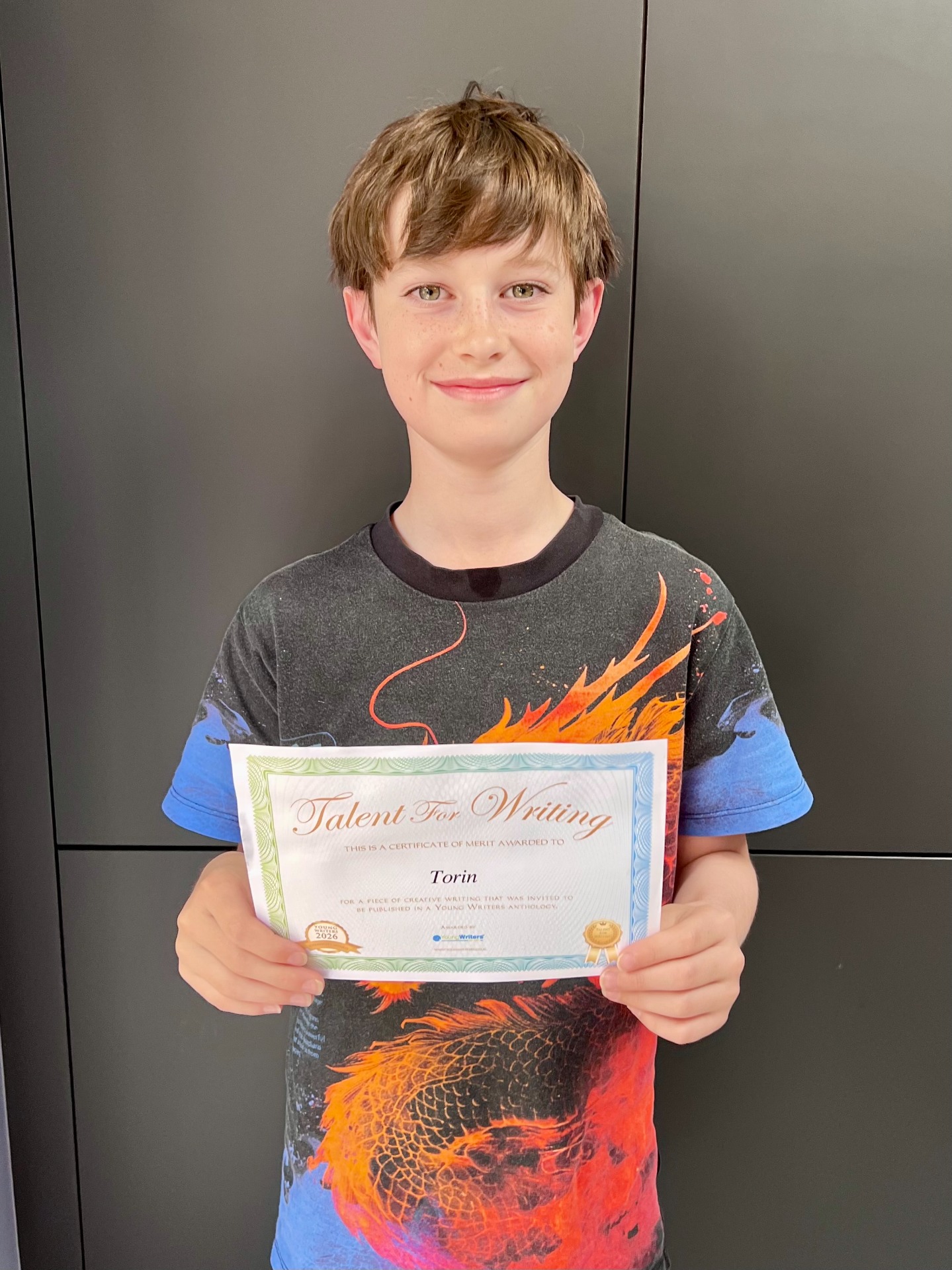 Torin with his certificate from the competition.