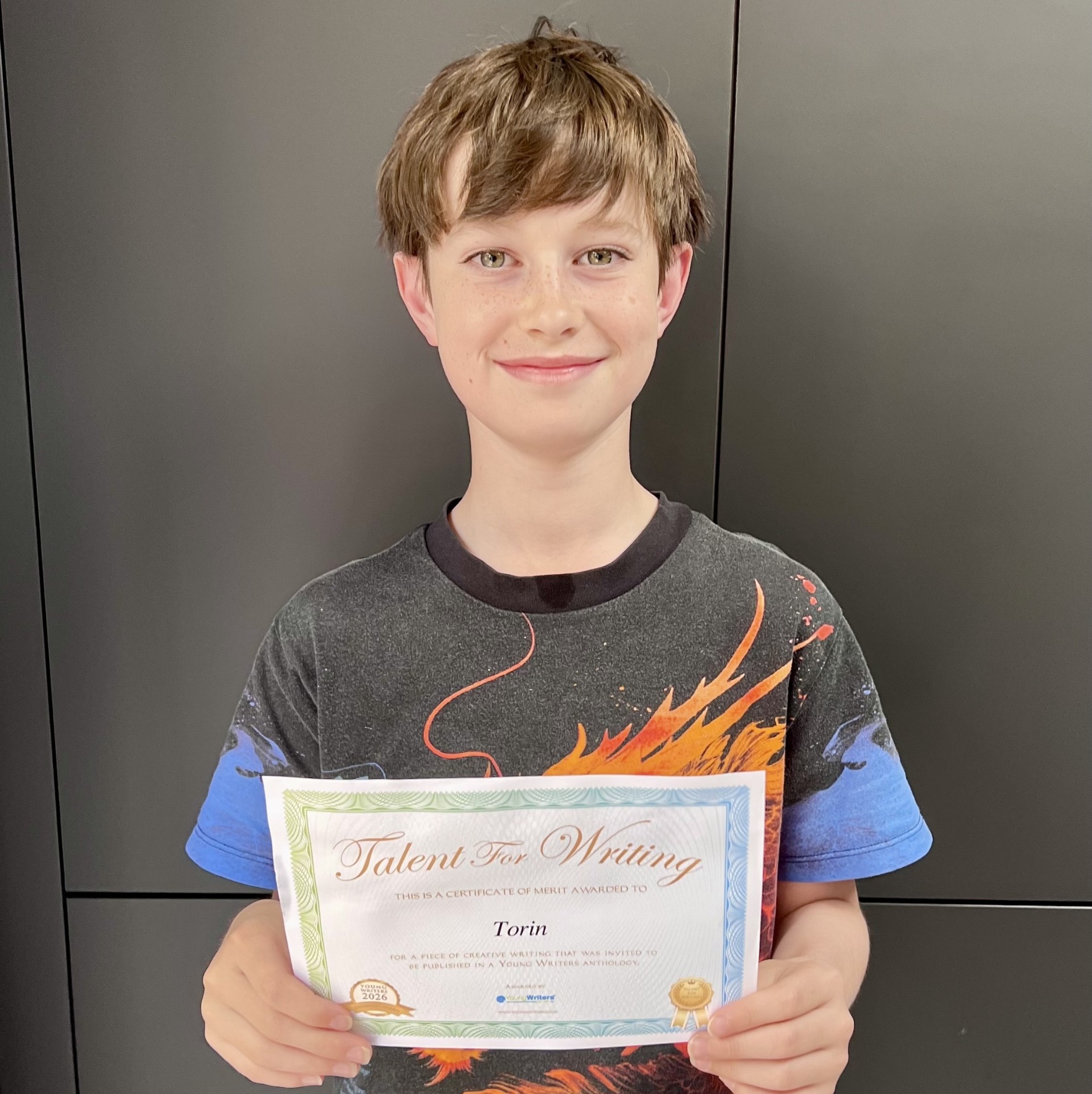 Torin with his Talent for Writing certificate.